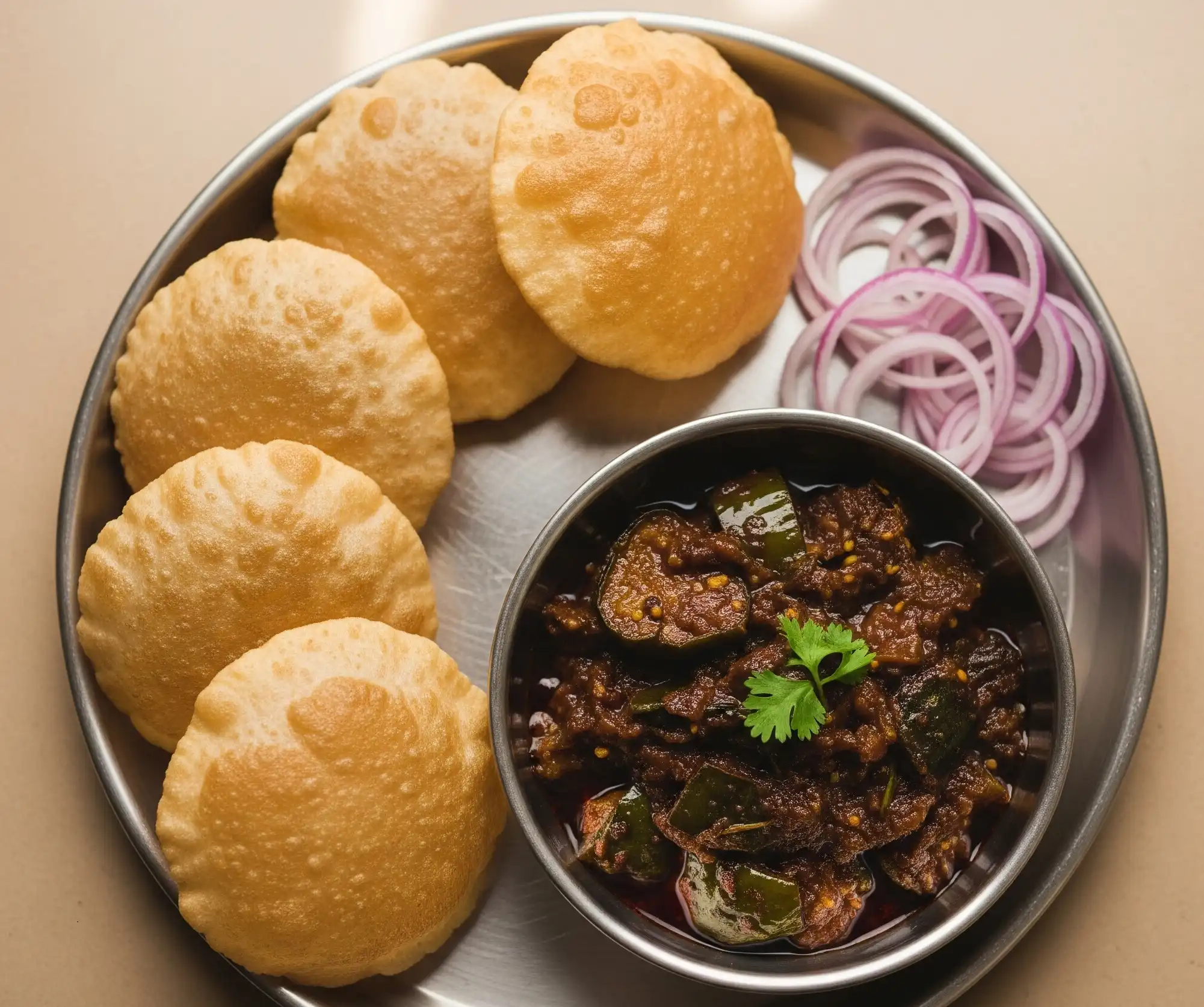 Steel plate tiffin with puris and spicy curry – Nashik weekend special